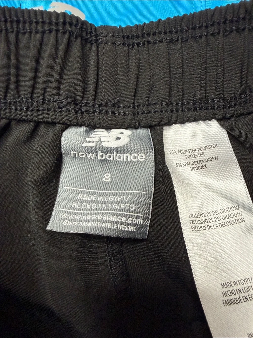 Kid’s New Balance Bright Blue Polo and Black Athletic Shorts Set. Size: 8